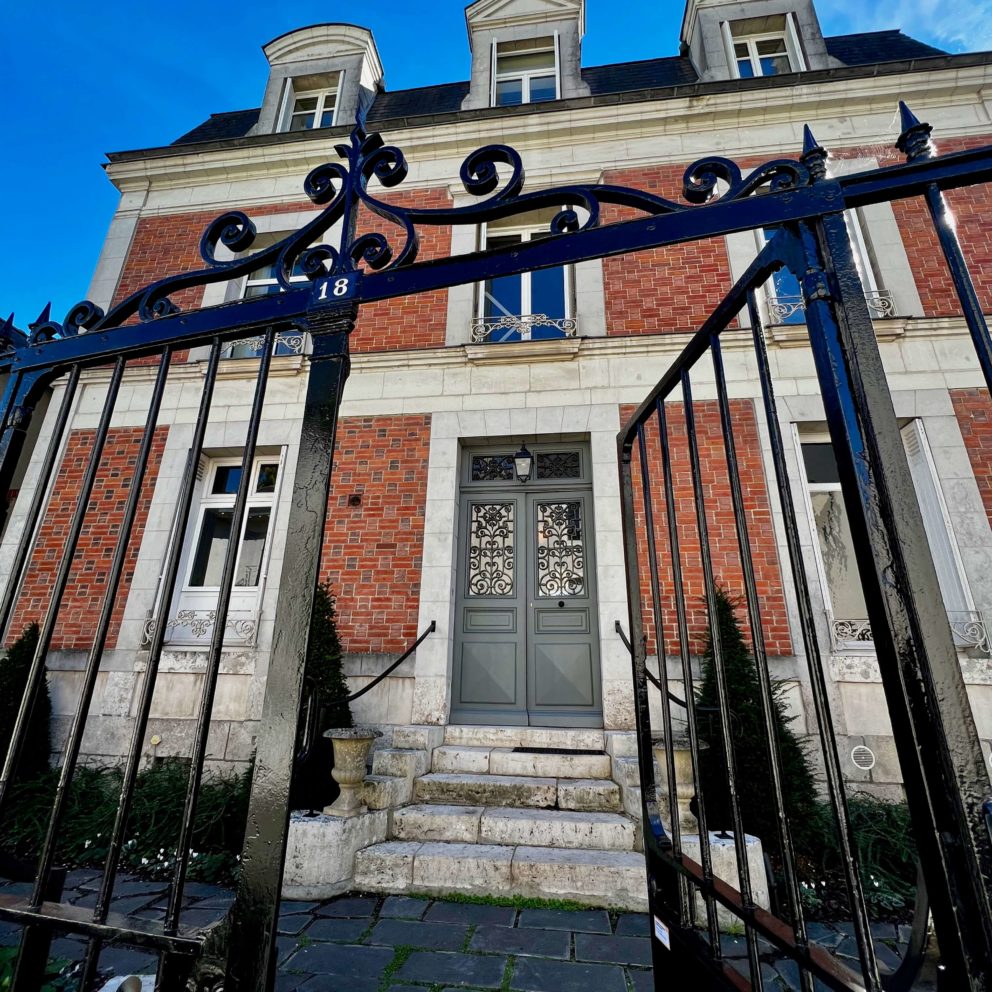 A stately view of the historic architecture and period details of Maison Loire.
