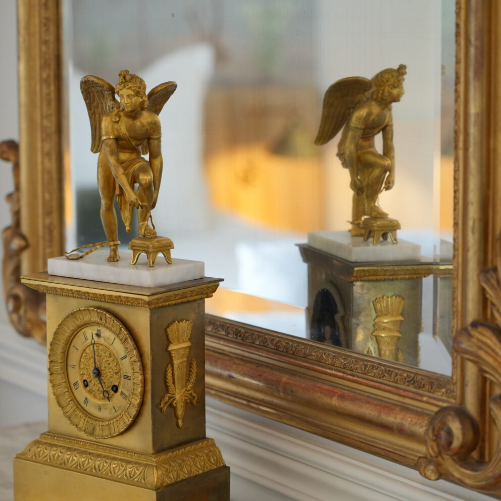 This empire period gilt bronze mantle clock adorns one of our guest rooms at Maison Loire boutique hotel.